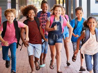 Kids running with backpacks on